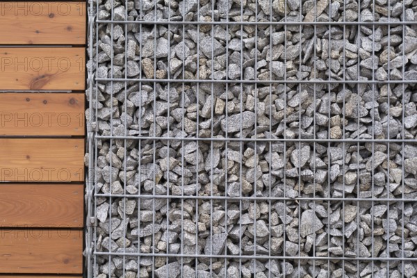Close-up of stone-wood fence - text free space