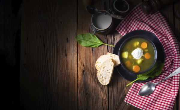 Rustic sorrel soup with potatoes and cream