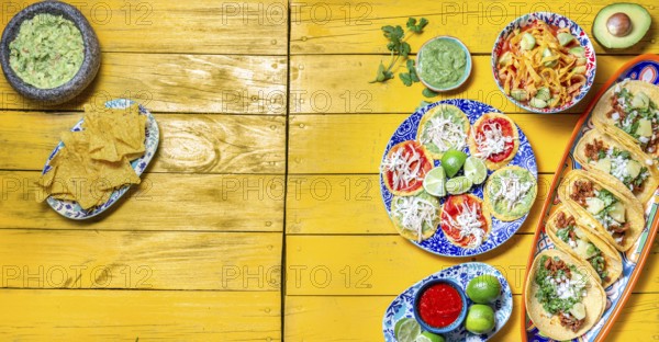 Food, Food, Mexican festive food for independence day, independencia chiles en nogada, tacos al pastor, chalupas pozole, tamales, chicken with mole poblano sauce. Yellow background