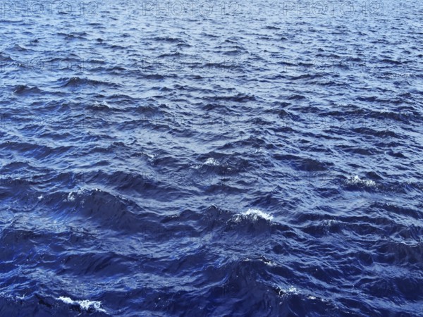 Photo of blue water background with ripples