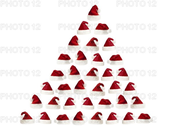 Isolated fluffy red Santa's hats over white