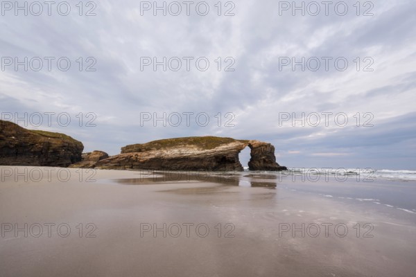 Natural rock arch in beach of Cathedrals in Lugo, Galicia, Spain, Europe