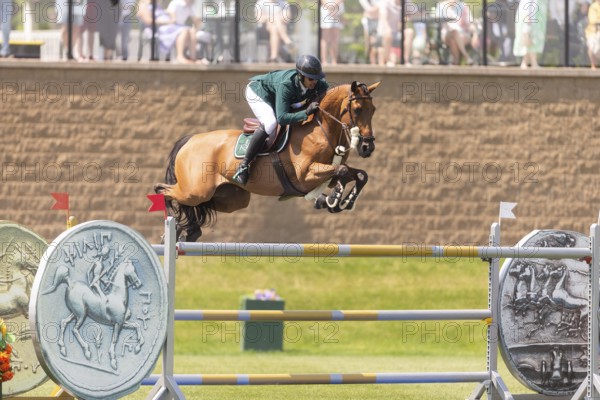 Abdulrahman Alrajhi from Saudi Arabia and riding Heartbeat W, compete in the 1.60m Grand Prix during The Continental international competition at Spruce Meadows, in Calgary, Canada, North America