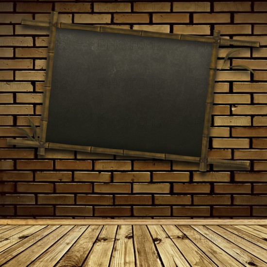 Old bamboo blackboard on the brick wall