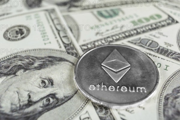 Silver Ethereum macro photo on hundred dollars bills