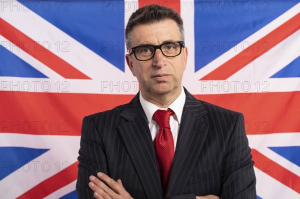 English UK businessman with suit on british flag