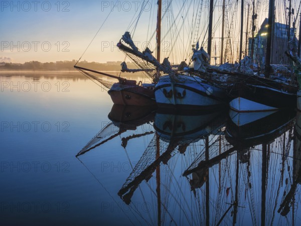 Sailing ships in the morning in the city harbour of Rostock