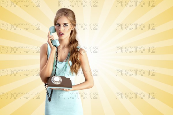 Creative photo of a pretty pin up girl talking about vintage phone on colourful abstract cartoon style background
