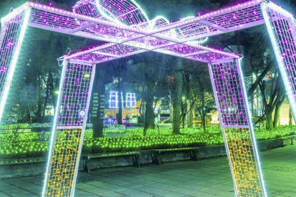 Taebeck, South Korea. January 29, 2019: Structure resembling wrapped gift made of lights on display downtown during winter festival
