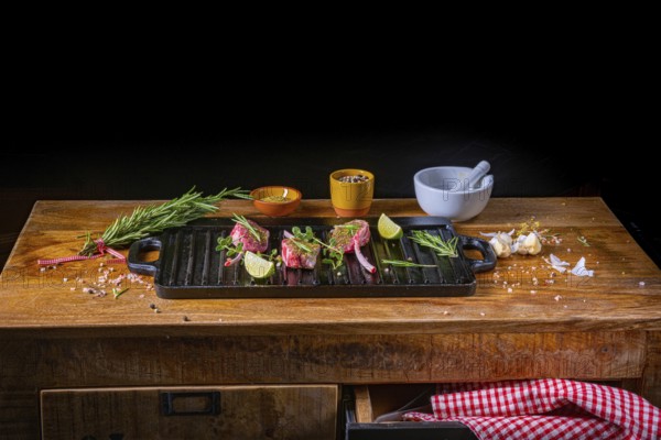Seasoned and herb-marinated raw lamb chops