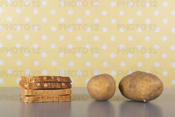 Bread and potatoes full of carbohydrates on the table