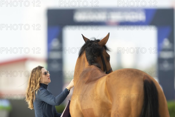Horses, grooms and riders take part in the vet check assessing the health of the horse before competition begins at the Longines Global Champions League event in Miami Beach, Florida, USA, North America