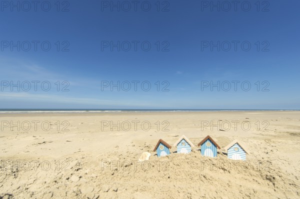 Summer beach with landscape and wooden huts