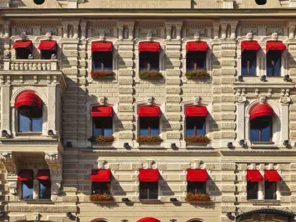 Old building with decorated windows at street of fiver Mojka, St. Petersburg