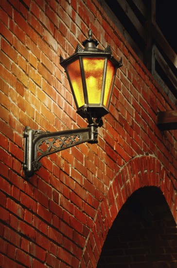 Lantern on the red brick wall