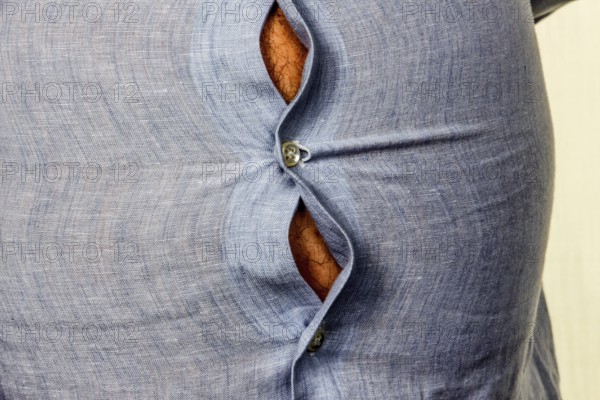 Man with excess weight. Symbolic photo of a beer belly, unsuccessful diets and poor nutrition. Austria