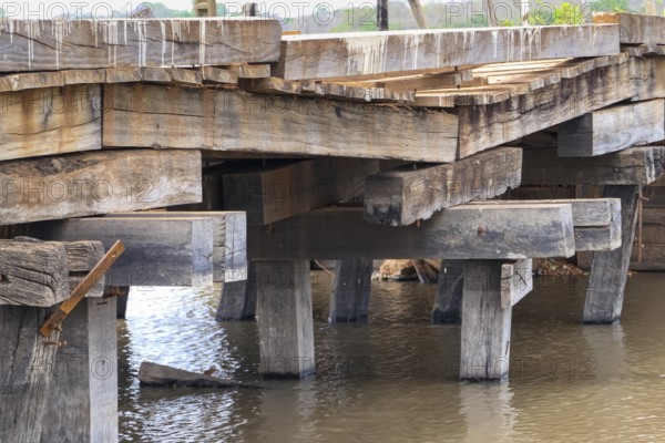 Run-down wooden bridge of the Transpantaneira crossing a river, Pantanal Wetlands, Mato Grosso, Brazil, South America