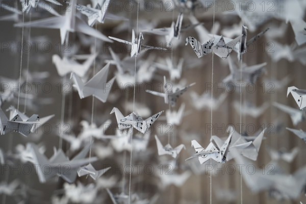 White Origami cranes paper closeup swarm macro photo