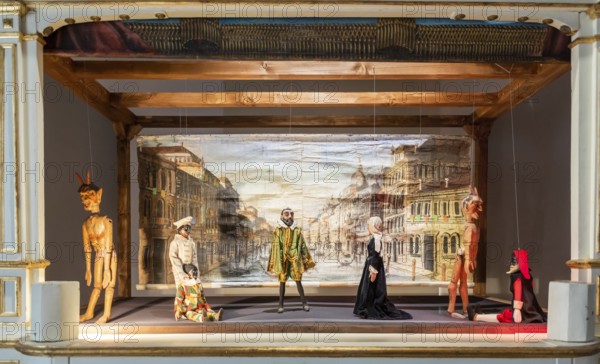 Vintage puppet show theatre made of wood. Old historical puppets
