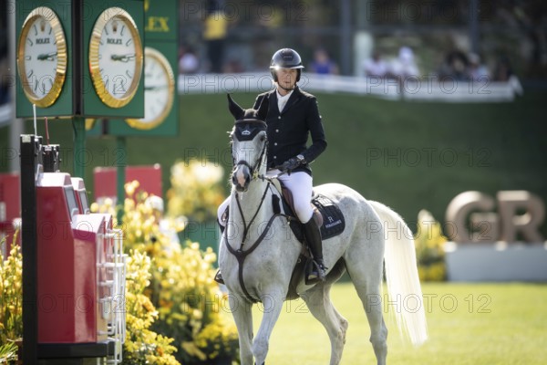 Martin Fuchs of Switzerland and riding Leone Jei compete in the first round of the 1.60m CPKC International during the Spruce Meadows Masters, presented by Rolex, in Calgary, Alberta, Canada, North America