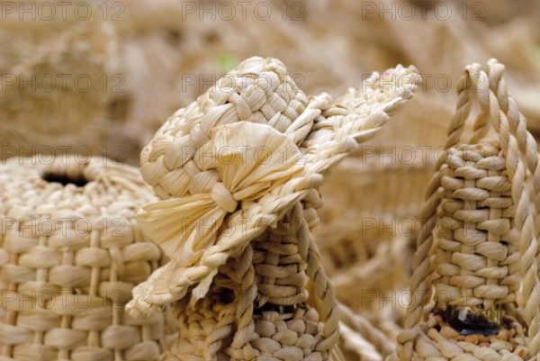 Basketry market on nature. Wicker cover for bottles