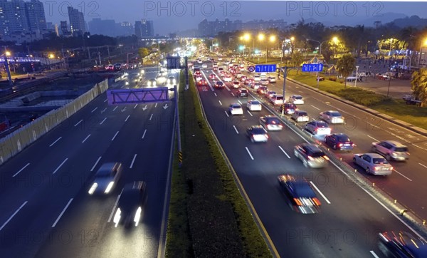 Dense traffic at evening rush hour on a main street in Kaohsiung, Taiwan, Asia