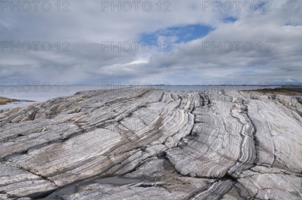 Rock formation on the coast of the Norwegian Sea along the famoust tourist attraction Atlantic Ocean Road close to the Norwegian village Vevang
