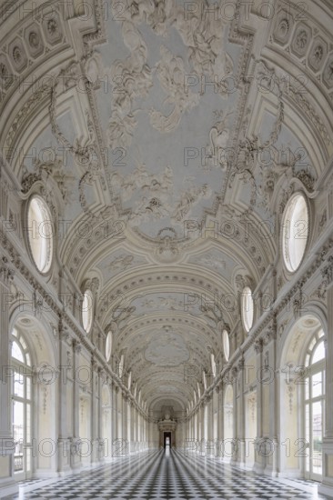 Magnificent, bright baroque corridor with ornately decorated ceiling, Palace of Venaria Reale, residences of the House of Savoy, Turin, Piedmont, Italy, Europe
