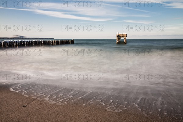 Groyne and jetty remains on the coast of the Baltic Sea