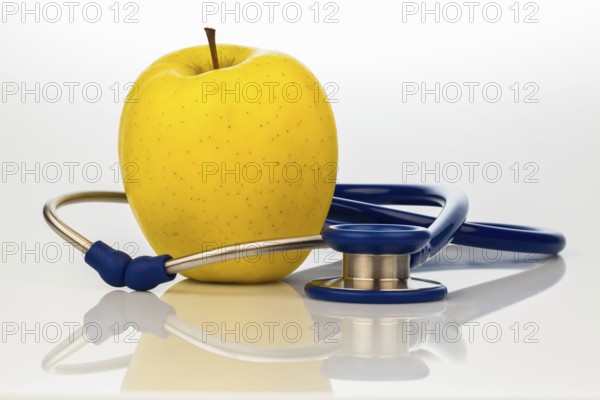 A stethoscope and an apple. Symbolising healthy nutrition. Austria