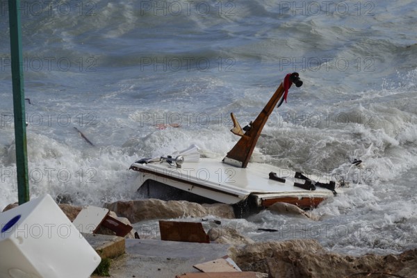 Destruction on the coast of the Côte d'Azur in Roquebrune Cap Martin and Menton after storm in connection with heavy rain, washed away beach promenade, destroyed boats, flooded infrastructure, clean-up work, department Alpes-Maritimes, region Provence Alpes Côte d'Azur, France, Mediterranean Sea, symbolic image climate change, Europe