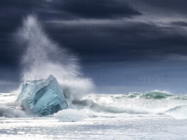 Diamond Beach, iceberg in the surf, near Jökulsarlon glacier lagoon, Vatnajökull National Park, Hornafjörður, South Iceland, Iceland, Europe