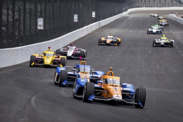 SCOTT DIXON (9) of Auckland, New Zealand comes down the front stretch at the Indianapolis Motor Speedway during a practice session for the Indy 500 in Speedway, IN