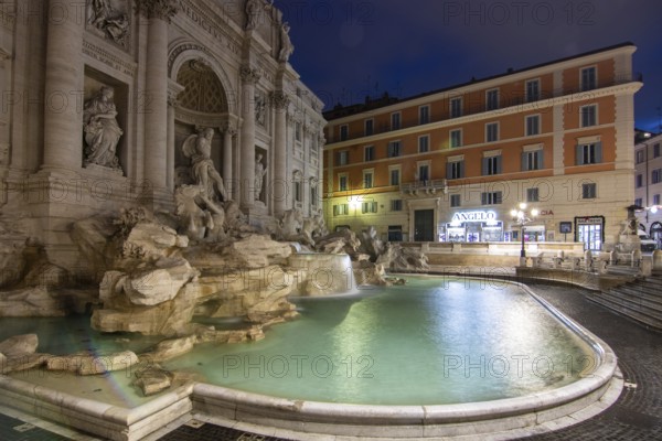 The Trevi Fountain, one o'clock in the morning at the blue hour. No people, but well lit. Monumental fountain on the Piazza di Trevi in front of Palazzo Poli. Fontana di Trevi, Rome, Italy, Europe