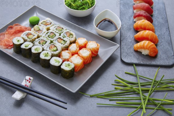 Sushi Maki and Niguiri California roll with seaweed chuka salad soy sauce and wasabi