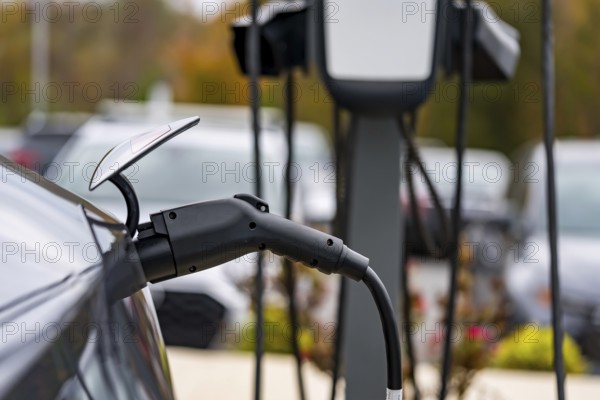 An electric vehicle recharges at a station while its owner is at work, allowing for a fully charged battery by the time they return. This setup maximizes convenience and reduces downtime, Ft Mill, United States of America