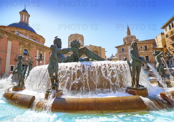 Valencia Turia river fountain in Plaza de la Virgen square of Spain