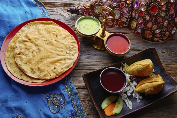 Samosa with Papadam indian recipe red and green sauces samoosa or sambusa