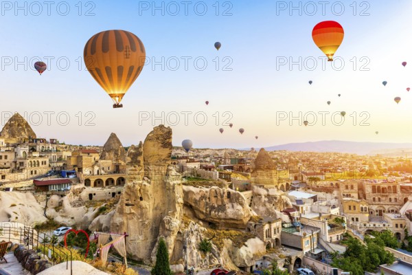 Hot air balloons over Goreme at sunrise, Cappadocia