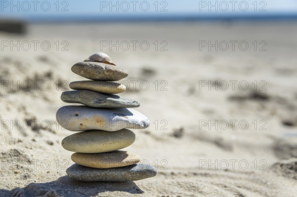 Round pebbles on the beach in Denmark is a symbol for balance. Stones on the beach in Denmark is a symbol for balance