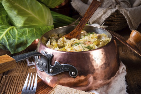 Young and fresh cabbage cooked with bacon cubes