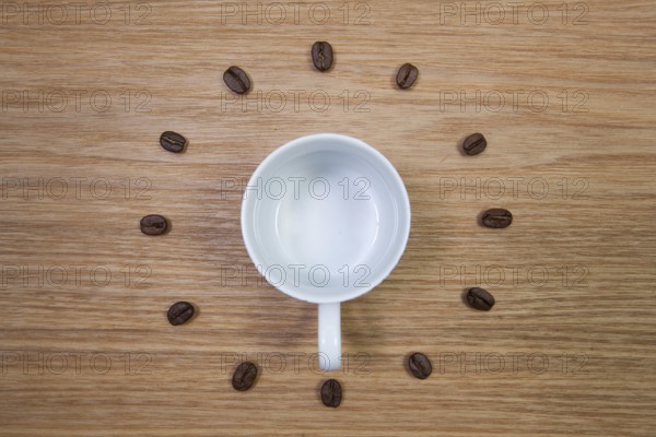 Coffee Time - Empty coffee cup and clock of coffee beans