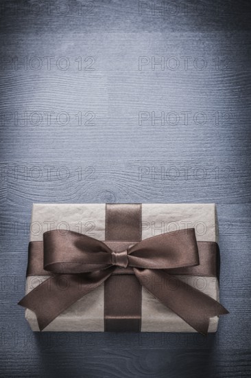Present box on vintage wood board copy space holiday concept