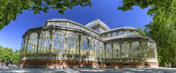 Panorama of Palacio de Cristal (Glass Palace) in Buen Retiro Park in Madrid, Spain, Europe