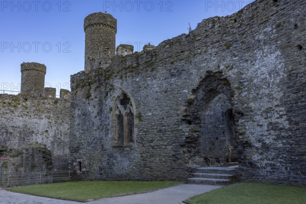 Conwy Castle, inner courtyard of the medieval castle ruins under a blue sky, Conwy, Wales, Great Britain