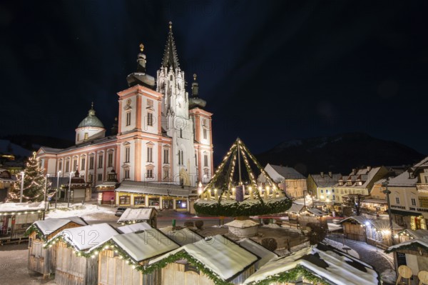 Christmas market in front of the basilica on the main square, night shot, Mariazell, Upper Styria, Styria, Austria, Europe