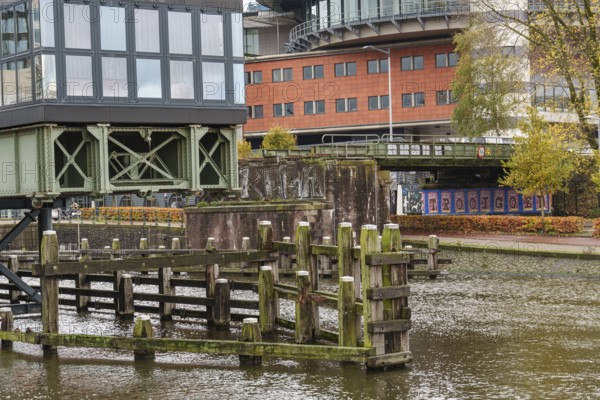 Old canal area with bridge and street art, autumn atmosphere, Amsterdam, Netherlands