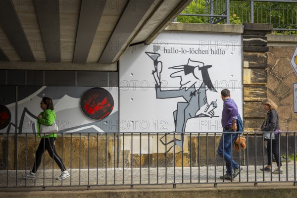 Two visions of the city of Radebeul have been realised in the spirit of Udo Lindenberg. The renovation and upgrading of Bahnhofstrasse in the Radebeul-West centre redevelopment area has been completed. Udo Lindenberg's mural Keine Panik (No Panic) and Burkhard Schade's tourist boards from the city's cultural advertising programme will welcome visitors to the city at Kötzschenbroda station, Radebeul, Saxony, Germany, Europe