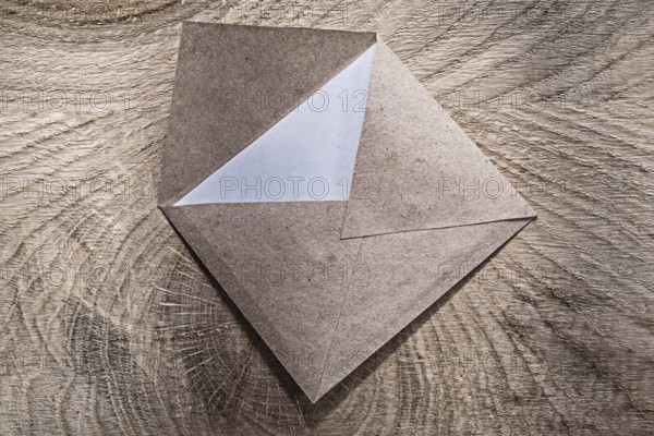 Vintage envelope on wooden board top view