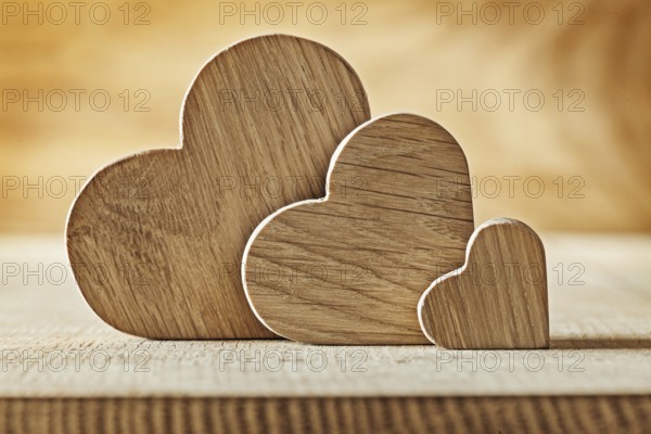 Wood hearts on wooden background